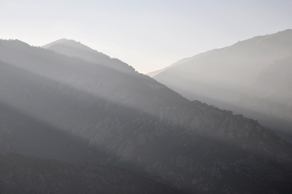 Mountain peaks lit by the setting sun in Corsica.