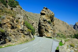 Eroded red granite of the Scala di Santa Regina canyon.