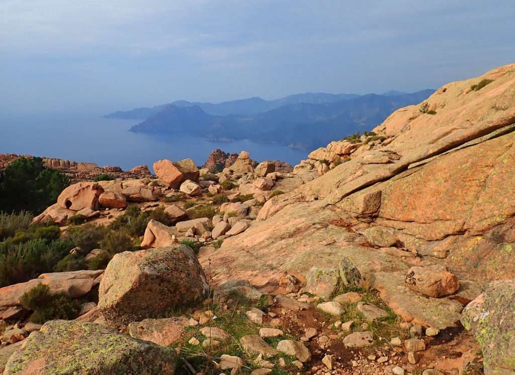 Red granite rock along the trail to the Capo d'Orto summit.