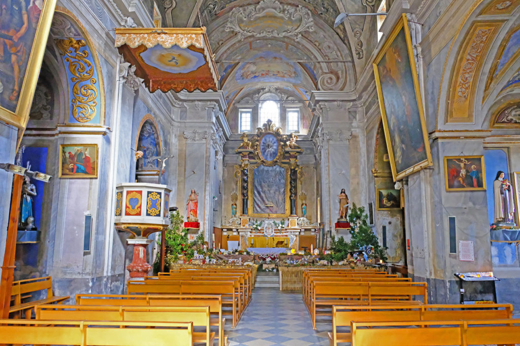 The inside of the church in La Porta exhibits highly ornate, elaborate detail and flamboyant frescoes.
