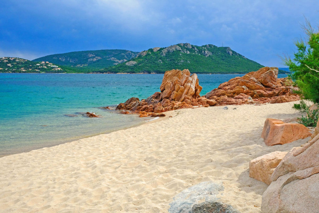 Evocative, brightly-coloured landscapes of Cala Rossa remain peaceful even in the peak season.
