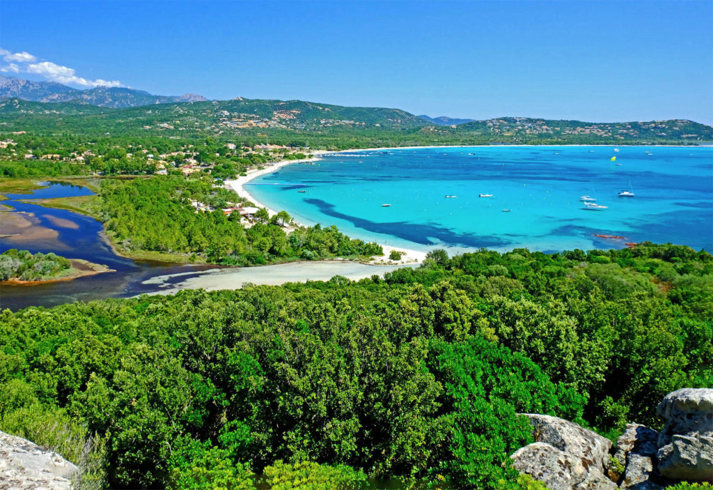 The shell-shaped bay of Saint Cyprien is famous for its transparent, shallow water and a relaxing ambiance.