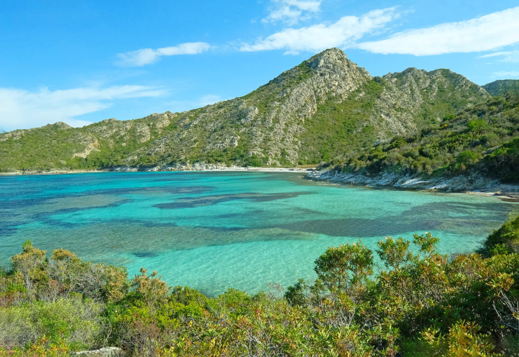 Plage de Valdolese is overlooked by a 150 m high granite spur covered in dense Corsican maquis.