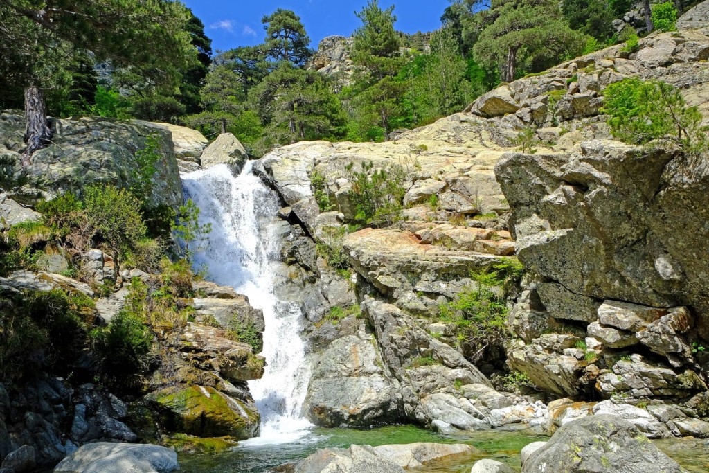 Wet and slippery rock surfaces near the river require extra attention when hiking.