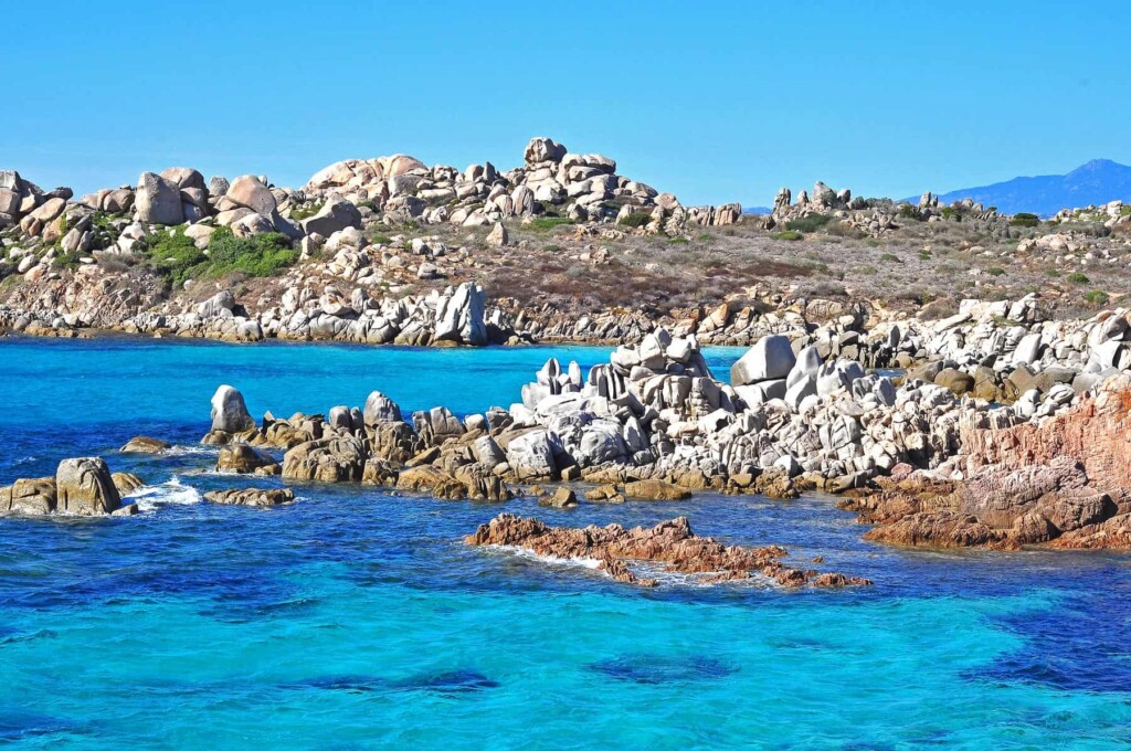 Cala di Chiorneri located in the southern part of Lavezzu is a delightful small cove of white powder sand and intensely turquoise water.