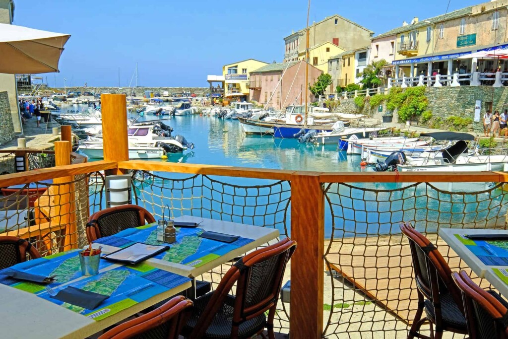 Even if you are on a budget you may enjoy delicious Corsican food and wine served by local restaurants.