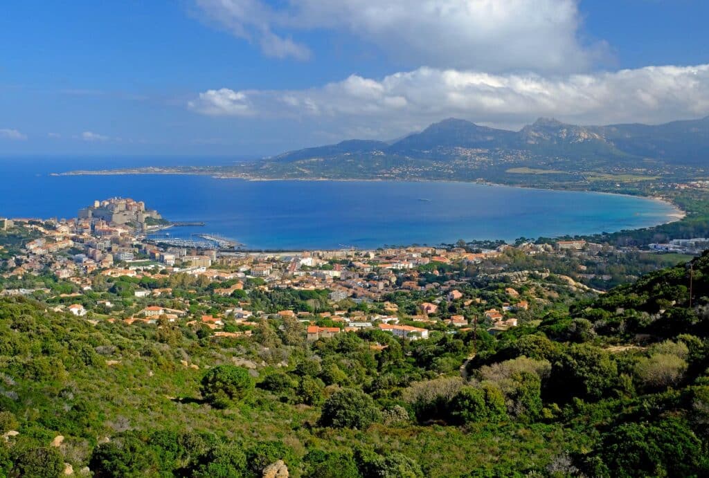 Calvi is blessed with a glorious shell-shaped turquoise-water beach bordered by aromatic Laricio pine trees.