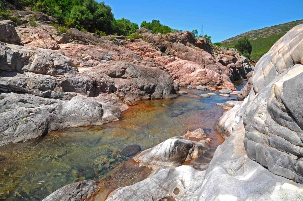 The Fango Canyon in Balagne is a well-known destination for fun-filled family river hiking.