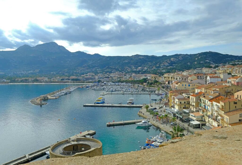 Hop on a boat in the Calvi port to visit the Scandola Reserve and Calanches de Piana, Corsica's top attractions.