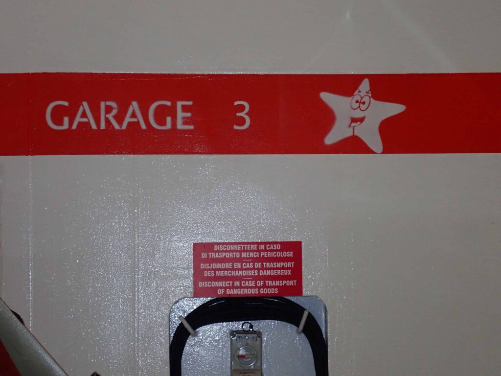 Before you go upstairs to the ferry's upper decks, take a photo of your parking space marked on the wall.