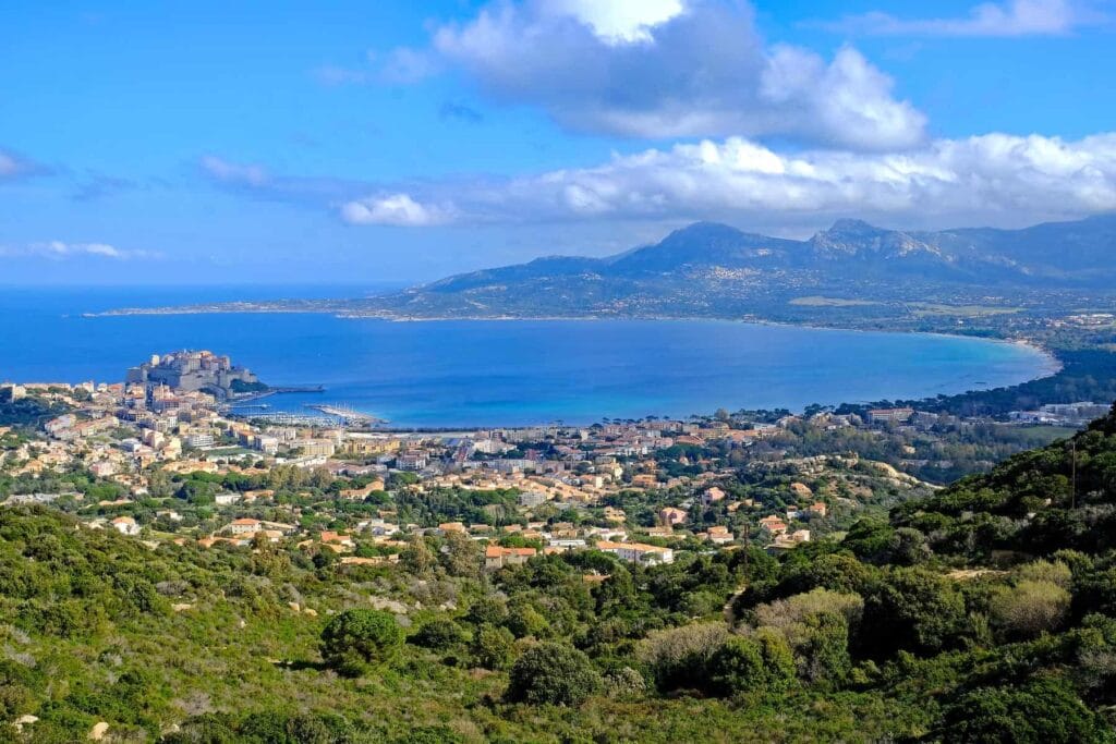 Calvi’s sweeping sandy beach is perfect for sunbathing, swimming, or practising water sports. 