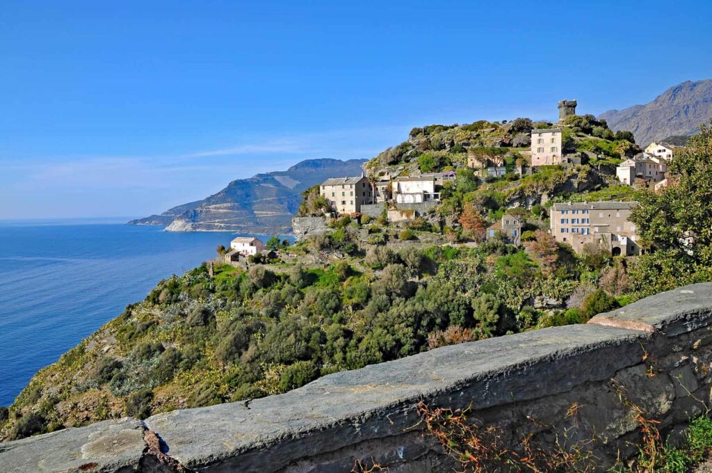 Nonza, a striking medieval village perched high on a cliff overlooking the sea on Cap Corse’s west coast.