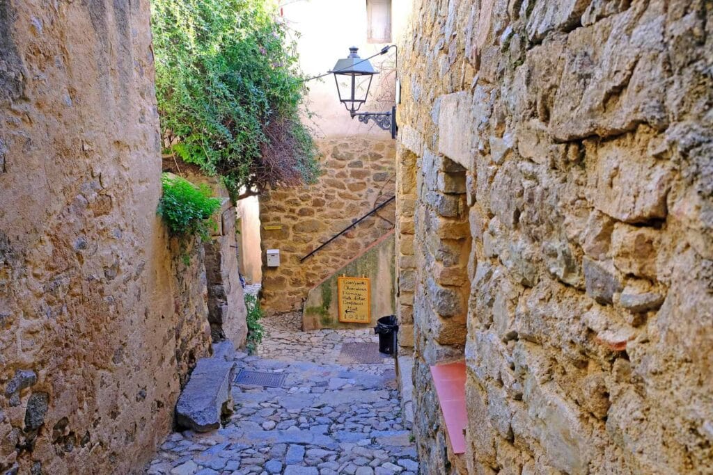 Pigna is famous for its narrow cobblestone streets, artisan workshops, and lively cultural festivals.