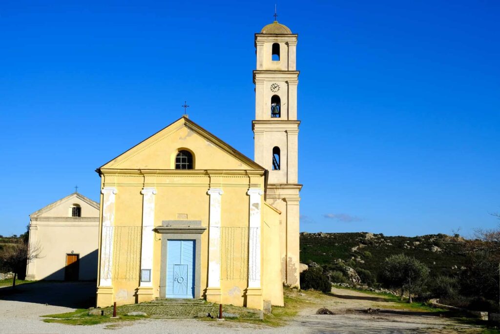 The Church of the Annunciation in Sant'Antonino is an imposing Romanesque building with a tall four-level bell tower.