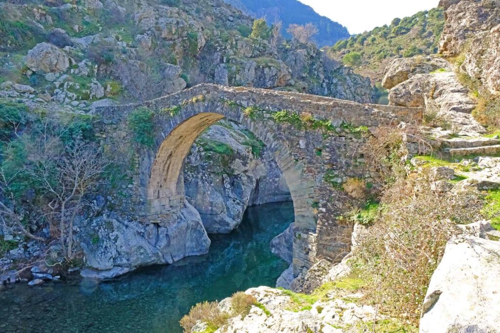 Asco's beautiful Genoese bridge marks a popular spot for wild swimming.