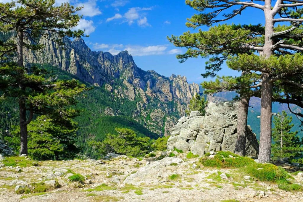 Towering granite pinnacles, ancient pine forests, and crystal-clear streams make Bavella a majestic natural playground.