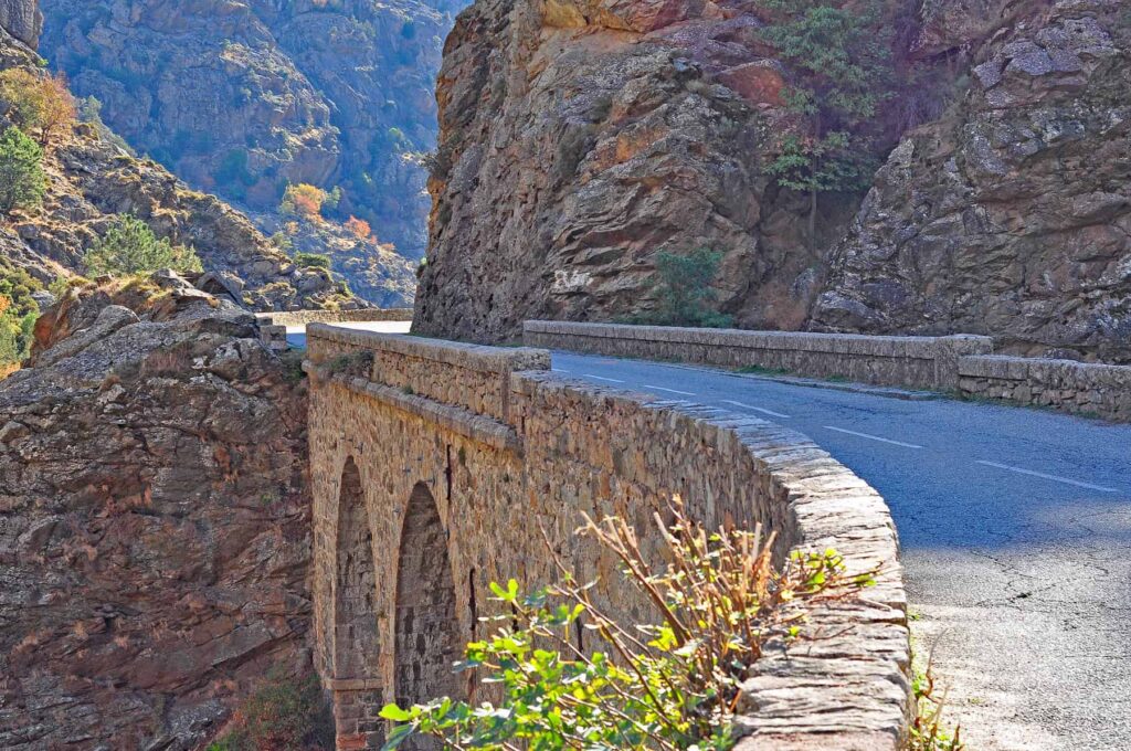 In Corsica, narrow bridges and blind bends come with unforgettable scenery all around.