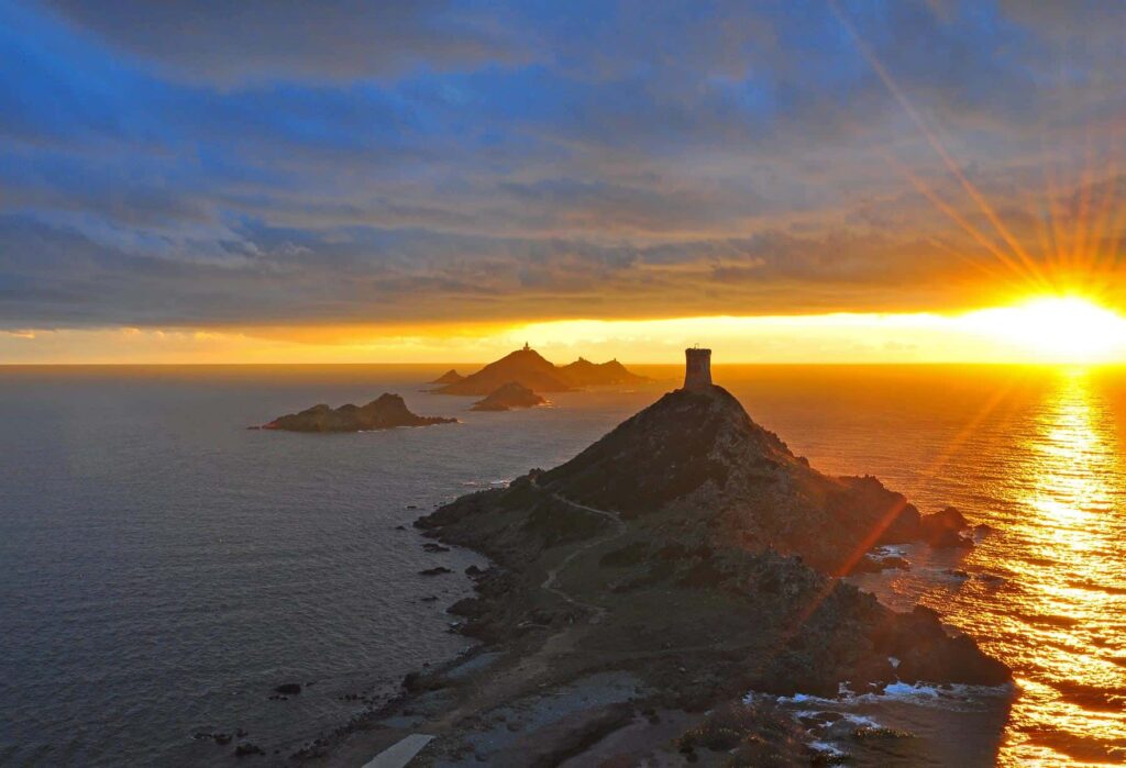 The Sanguinaires Islands ignite with fiery colours as the sun dips, creating a mesmerising coastal spectacle.