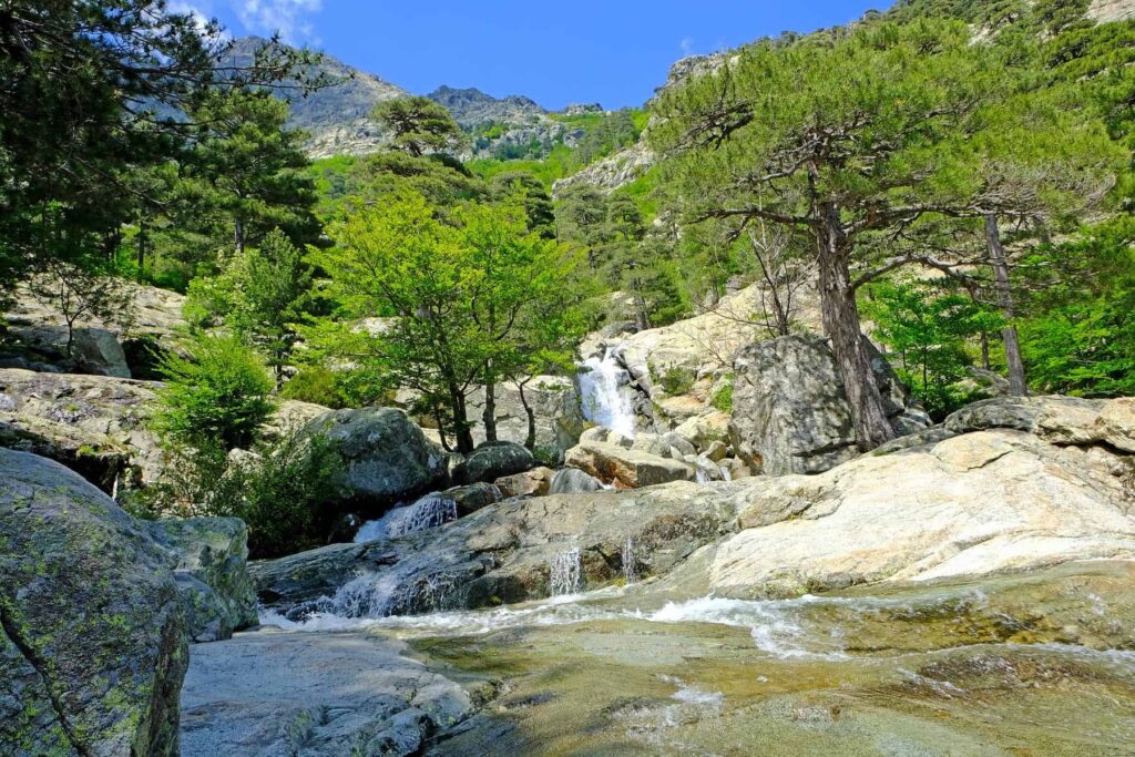 Cascade des Anglais waterfalls form a majestic water-and-granite landscape at the foot of Monte d'Oro in the Vizzavona forest.