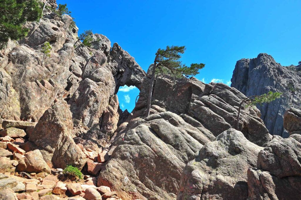 The easy hike to Trou de la Bombe offers awe-inspiring views of Bavella's regal scenery.