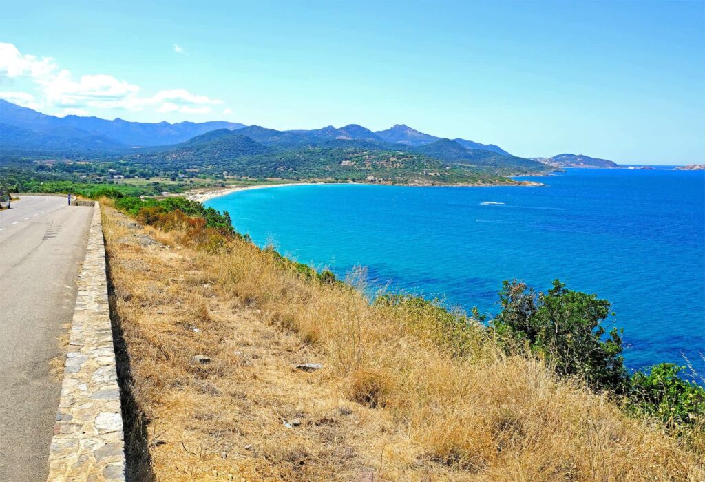 Lozzari’s long curve delivers endless gold sand and gentle waves for all-day relaxation.