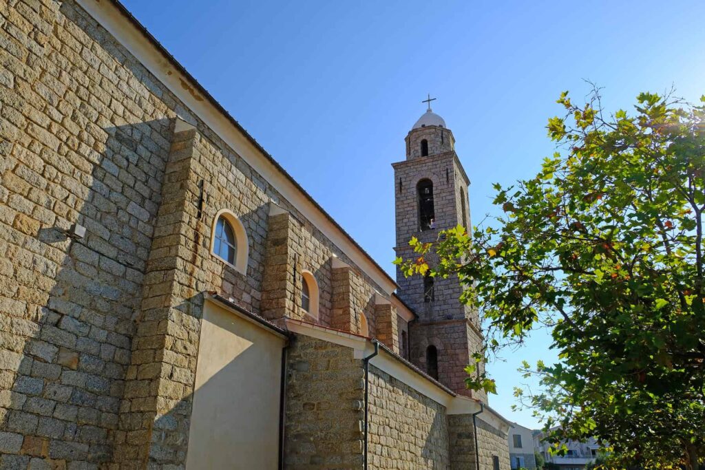 The town church, with its elegant stone façade, towers over Propriano and the harbour below.