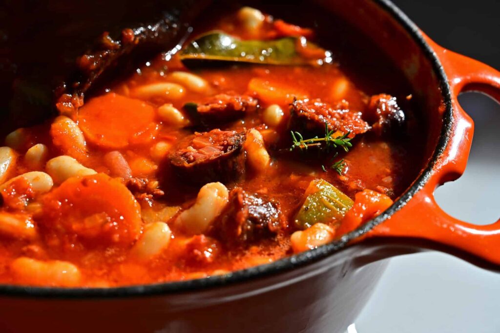 Figatellu, a Corsican pork liver sausage, pairs well with legume-based stews and robust red wine.