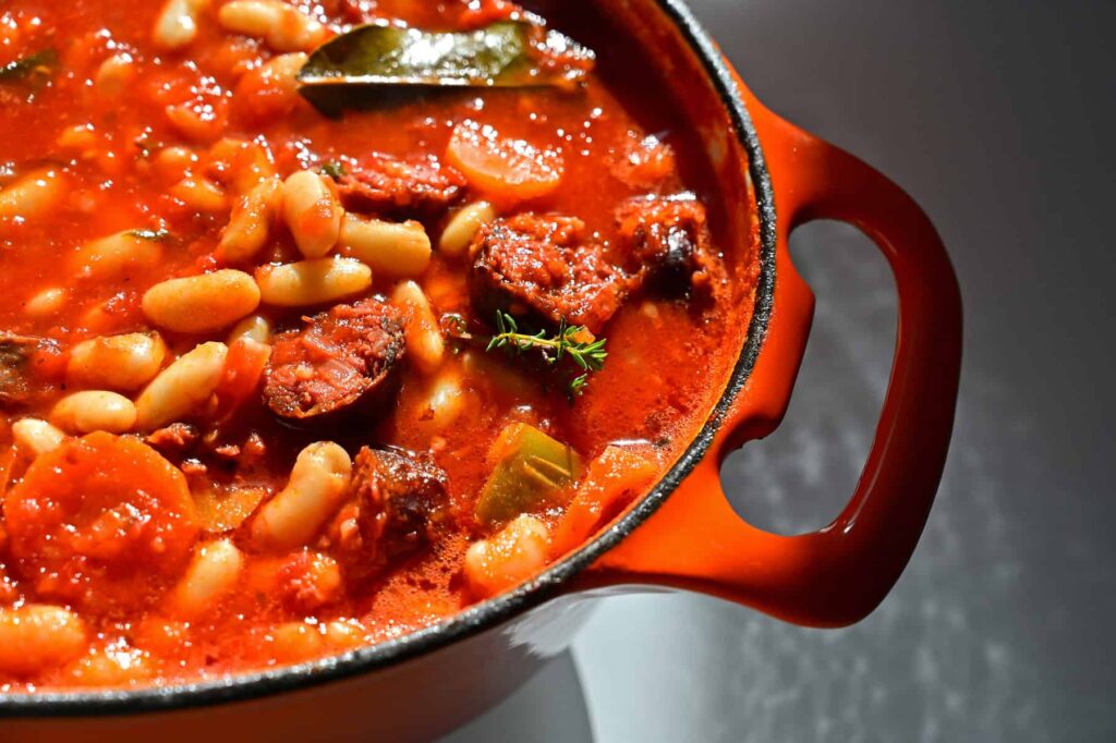 Fibre and protein-packed figatellu and white bean stew delivers balanced nutrition and bold flavours.