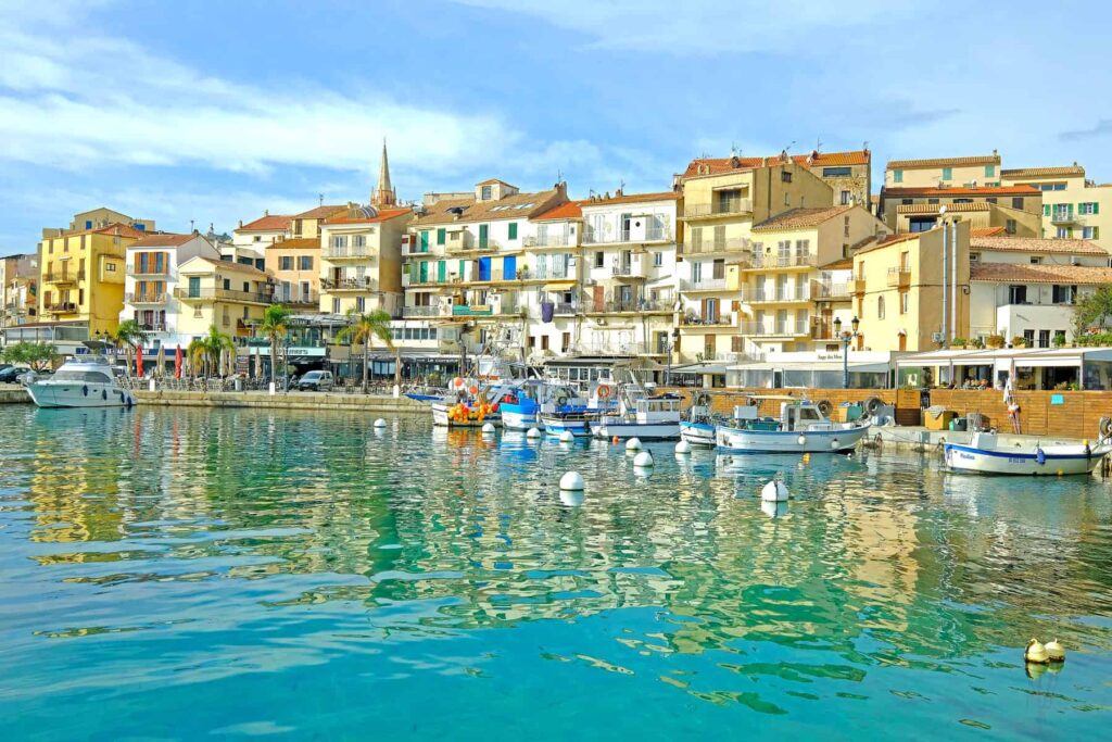 Calvi's marina buzzes with restaurants, cafés, and joyful vacation energy.