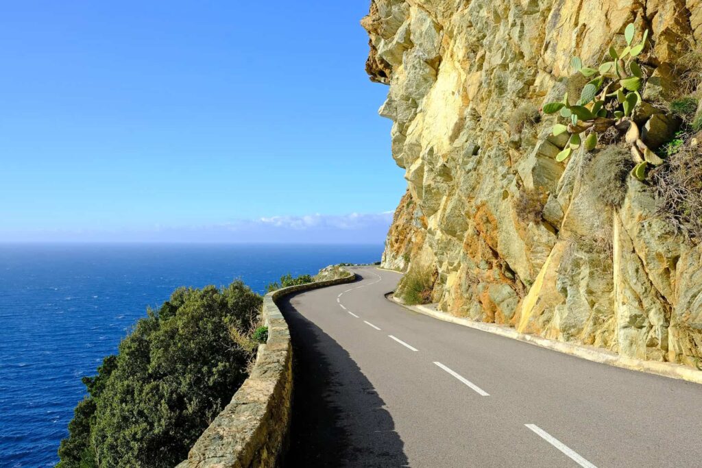 Driving along Cap Corse’s dramatic D80, where the road hugs the cliffs.