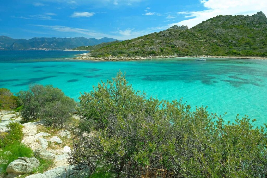 The exposed hike along the Agriates can be challenging during peak Mediterranean heat.