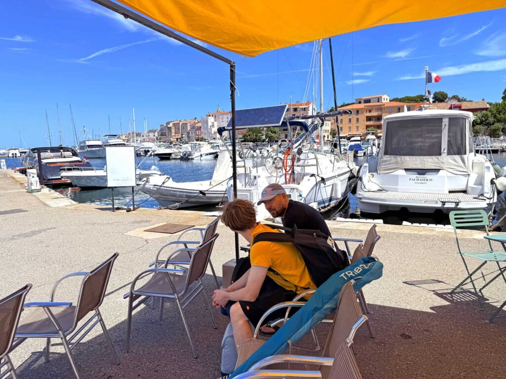 A shaded waiting area where you can relax before departure to the Agriates beaches.