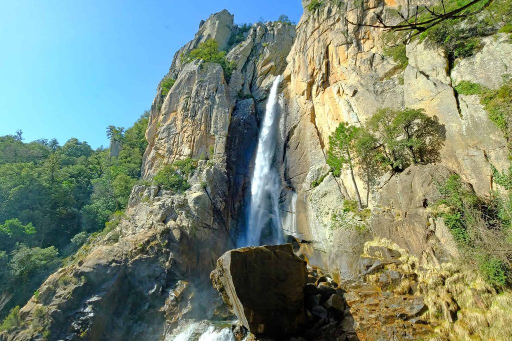 Under the midsummer sun, Corsica's mountain landscapes provide much-needed relief.