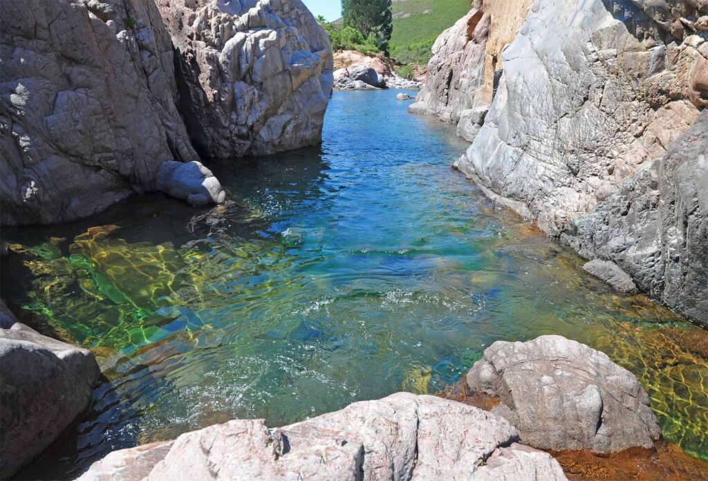 Warm crystal-clear waters, natural rock pools and wild scenery make Fango Valley a favourite summer escape near Calvi.