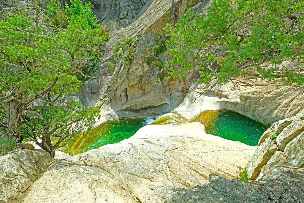 Some of Bavella’s most enchanting natural pools can only be reached on a guided canyoning tour.